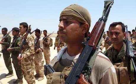 In this Wednesday, June 17, 2015 photo, Sunni tribal volunteers stand in formation during their graduation ceremony in Habaniyah, 80 kilometers (50 miles) west of Baghdad, Iraq — AP Photo.
