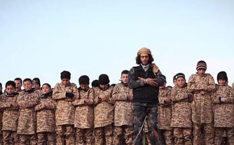 An ISIS propaganda photo shows a prayer session for child soldiers