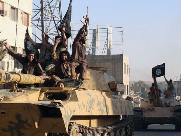 ISIS fighters during a parade in Raqqa, Syria. AP photo.