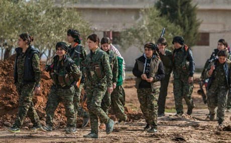 Kurdish female fighters of the YPG carry their weapons as they walk at the front line of Kery Sabee village, northeast Syria. AP file photo 