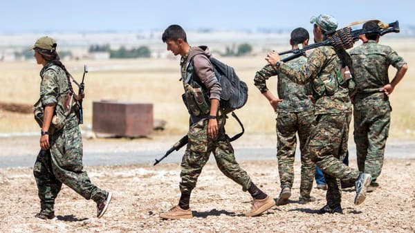 Syrian Kurdish forces in the town  of Tal Abyad on Wednesday. Photo: Reuters. 