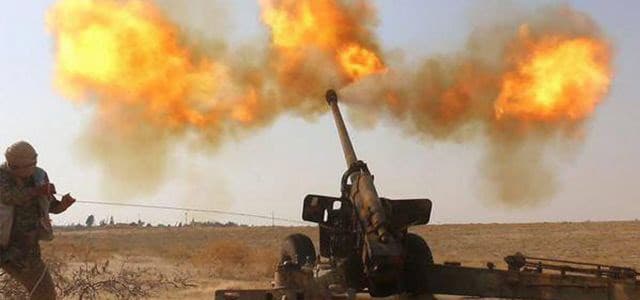 An ISIS fighter fires artillery against Syrian forces in Hama, Syria, June 23, 2015.(Militant website via AP) Photo credit AP. 