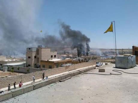  Plumes of smoke rise after an explosion in Kobani at the Kurdish Rojava region of Syria.