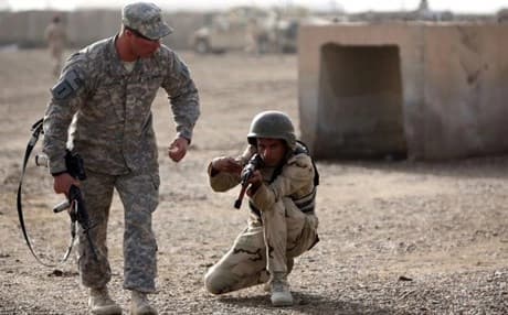 An American trainer instructs an Iraqi soldier north of the capital Baghdad, on January 7, 2015. AFP photo
