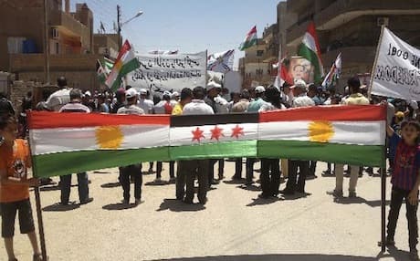 Kurds in the city of Afrin gather to welcome Arab refugees from other parts of Syria. Photo: AFP
