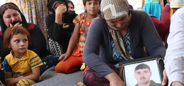Displaced Yezidis gather to mourn the death of a young boy, Farhad Ahmed, at Khanke camp on Tuesday, August 4, 2015.Photo by Hajir Sharifi