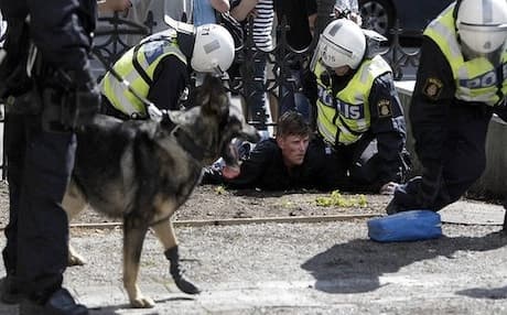 Swedish police detain a man during an anti-Islam demonstration in central Stockholm, 2012. Photo: AFP