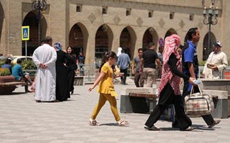 Iraqi Arab visitors walk past Erbil’s iconic Citadel. Authorities fear the flow of refugees could upset the Kurdish region’s ethnic balance. Photo : Rudaw