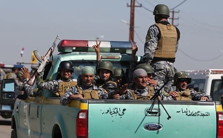   Members of Iraqi security forces coming from the city of Samara. AFP file photo 