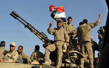 Iraqi forces arrive to protect a Shiite shrine in the city of Samarra. Source: AFP