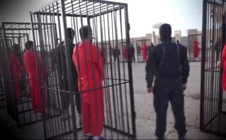 Screen grab of ISIS video of caged Peshmerga.