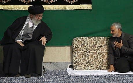 Qassem Soleimani (right) greets Supreme Leader Ayatollah Ali Khamenei during a religious ceremony in Tehran. Photo: AP