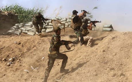 Iraqi forces battling ISIS in Baiji. AFP photo.