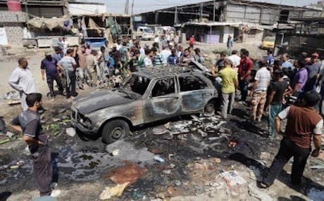 The aftermath of a car bomb in  Baghdad's Sadr City on August 13, 2015. AP Photo.