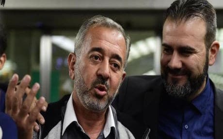 Syrian refugee Osama Abdul Mohsen (Left), speaking to journalists in Madrid. Photo: AFP