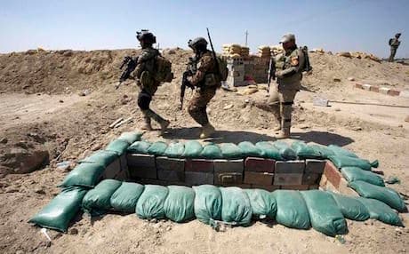 The Iraqi army digging a trench near Jurf al-Sakher south of Baghdad in preparation of possible ISIS attacks. May 2015. Photo: AFP