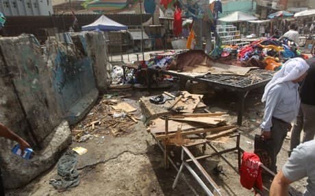 Residents pick up the pieces after the bombings. Photo: AP. 