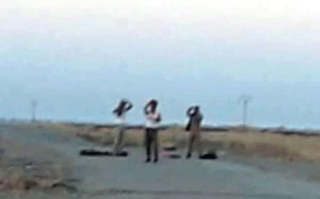 ISIS militants surrendering to Peshmerga forces. Photo courtesy of the Peshmerga. 