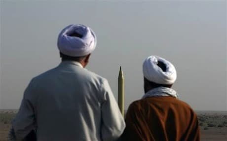 Iranian clerics look at a Shahab-1 missile during a military exercise in the Iranian desert. Photo: AFP