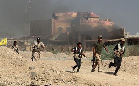 Iraqi forces seen in the center of Baiji. AP file photo
