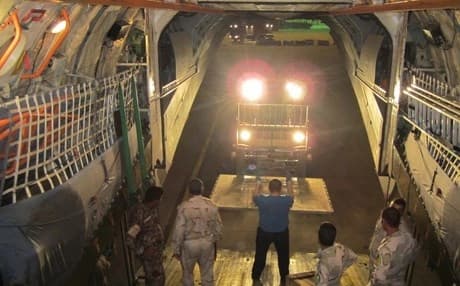 Images purporting to show chemical weapons protective gear being delivered to Baghdad by Russia on Monday. Courtesy photo from Russian Information Center. 