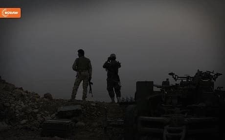Kurdish Peshmerga on guard near an ISIS frontline. 