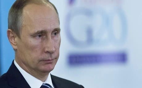 Vladimir Putin listens to a journalist's question during his news conference after at the G-20 Summit in Antalya, Turkey, Monday, Nov. 16, 2015. Photo: AP. 
