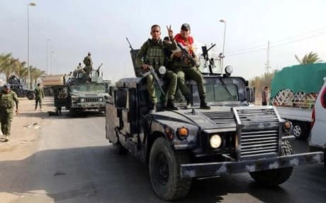 Iraqi security troops from Baghdad head to Ramadi on the orders of Prime Minister Haider Al-Abadi to reinforce troops there in their fight against the Islamic State of Iraq and Syria, on April 18, 2015. Photo: AP
