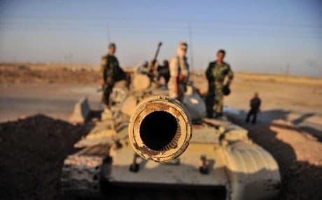 Kurdish Peshmerga forces stand guard in the oil-rich city of Kirkuk. Photo: Anadolu Agency, Getty Images.