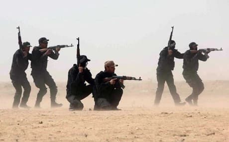 Members of the popular mobilization unit attend a combat training session in the city of Karbala, March 2015. AFP Photo