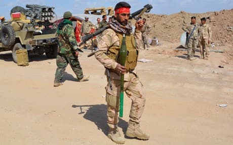 Iraqi Shiite militiamen near Tikrit. AFP photo.   