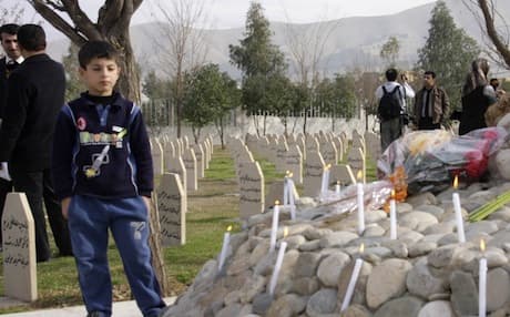 Residents of Halabja at the city's memorial cemetery. Photo: AFP