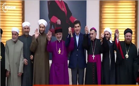 Kurdish Prime Minister Nechirvan Barzani (C) with Christian and Muslim leaders at the Assyrian Church of the East in Ainkawa.