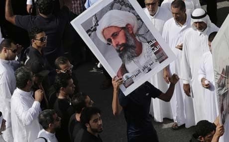 Saudi Arabians carrying a poster of Sheikh Nimr al-Nimr demanding his release, May 2015. Photo: AP