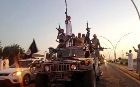  ISIS fighters parade through Mosul in June 2014. AP photo. 