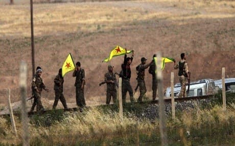 Kurdish People's Protection Units (YPG) fighters hold their organization near Tal abyad (Gire Sipi). photo: AP