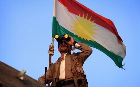 A Kurdish Peshmerga fighter holds a position on the front line in the Gwer district, south of Erbil. AFP Photo.