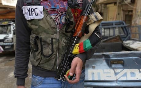 A fighter from the People's Defense Units (YPG) in Aleppo, Syria. April 2013. Photo: AFP