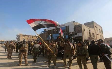 Iraqi security forces fly the national flag after they recaptured Ramadi. Photo: AFP