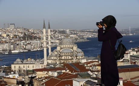 A tourist taking pictures in Istanbul. Photo: AFP 