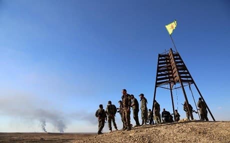    A group of YPG fighters gather on a hill top in al-Hol in the Syrian Hasakeh province on November 2, 2015. Photo: AFP 