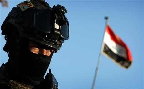  An Iraqi soldier stands guard at the entrance of the Nineveh base in Makhmour. Photo: AFP