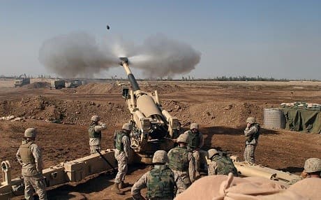 US Marines fire a Howitzer artillery gun during the Second Battle of Fallujah. / Photo by Lance Corporal Samantha L. Jones, USMC.