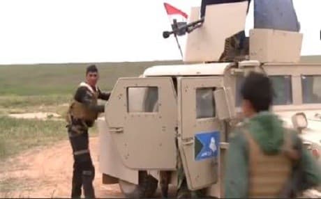 An Iraqi Army armored vehicle returns from fighting in Nasser village. Photo from Rudaw video.