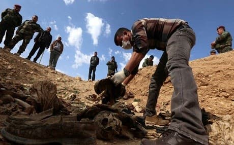  A mass grave being unearthed in Shingal last month. AFP photo.