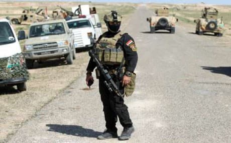 Iraqi soldiers at the frontline in the Anbar desert northeast of Hit earlier this month.  AP Photo.