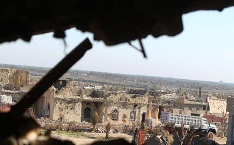 Damaged buildings in the rural town of Husayba , east of Ramadi on December, 2015. AFP Photo.