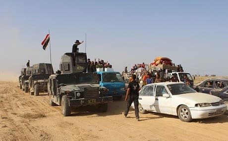 Iraqi government forces evacuated civilians last month from towns in Ramadi before beginning the ongoing offensive on Hit. AFP photo.