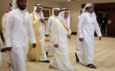 Saudi Oil Minister Ali al-Naimi, center right, arrives at an oil-producers' meeting in Doha, Qatar, on Sunday. Photo: AP