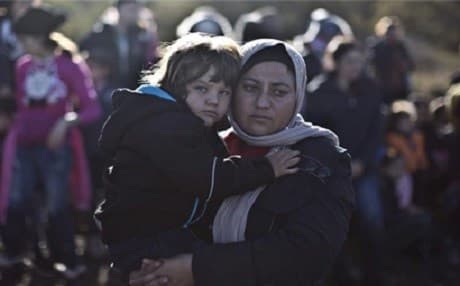 A Yezidi mother and child in Greece. Photo: Muhammad Muheisen/AP